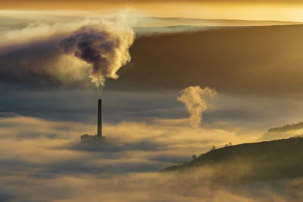 Factory with steam and fog in the air