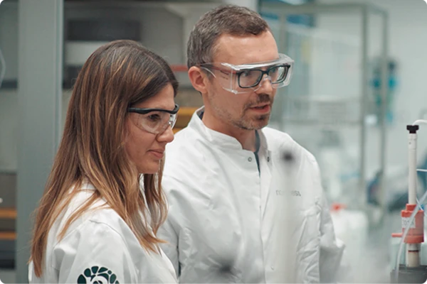 Girl and guy in laboratory in glasses