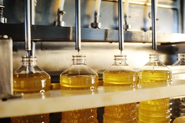 Four oil bottles in factory