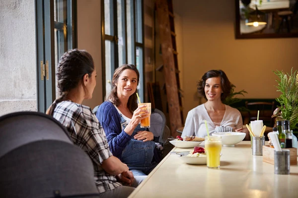 A pregnant woman drinking healthy juice