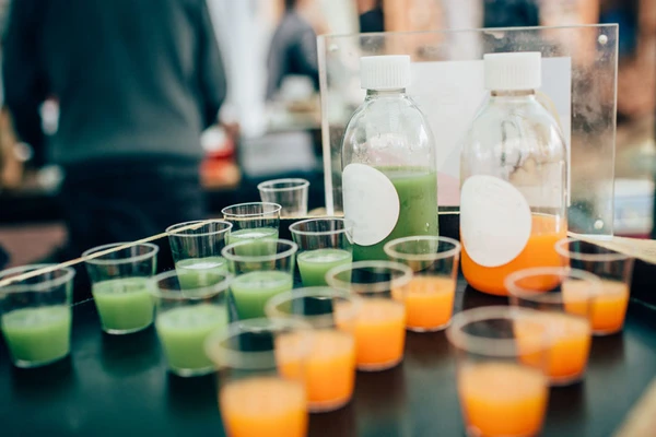 A row of vegetable juice samples