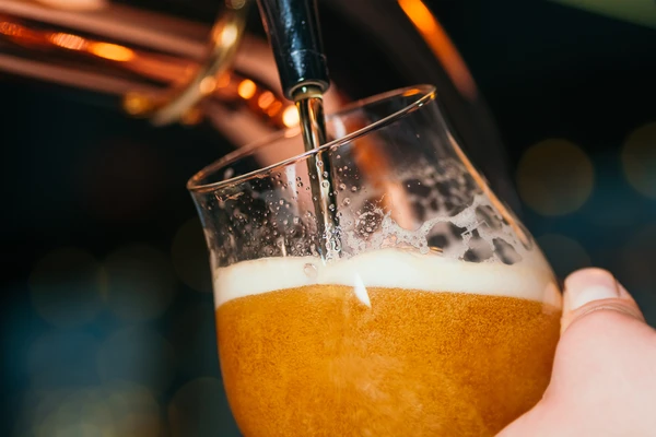 pouring beer on tap
