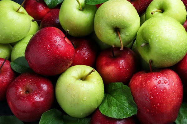 Red and green apples in stack