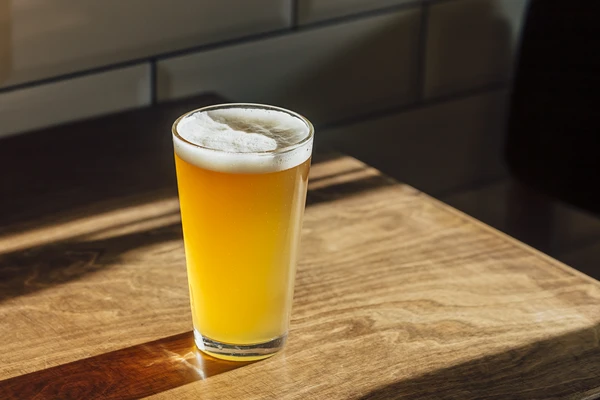 Beer on a wooden table light from window