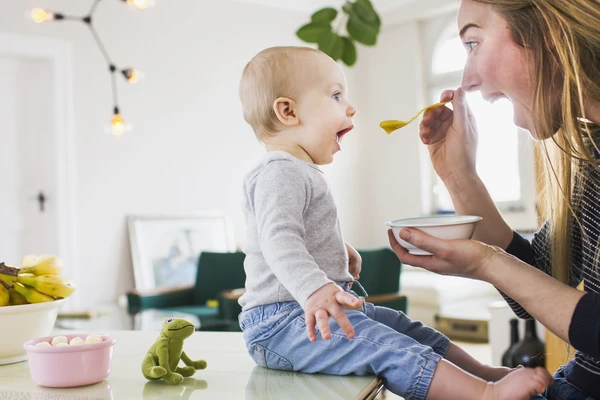 baby eating baby food