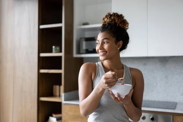woman eating yogurt
