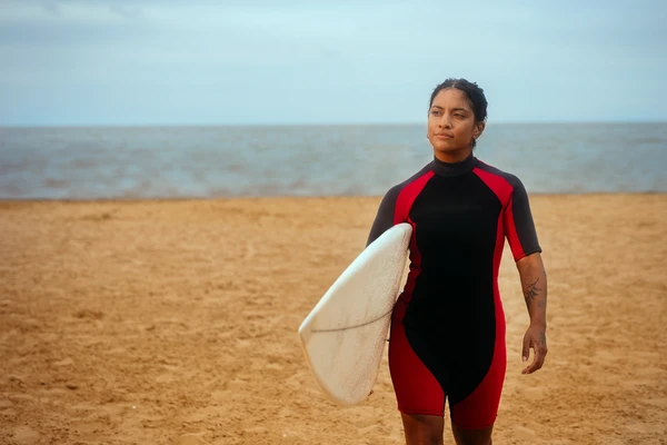 Woman surfing on the beach