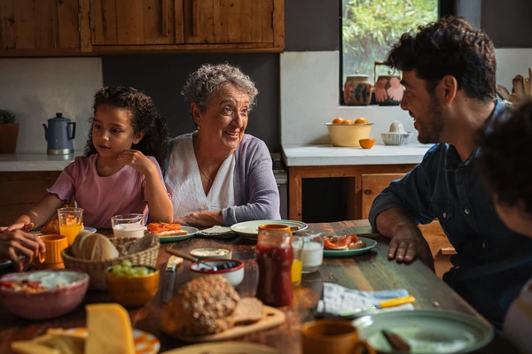 family-eating-smoked-salmon-in-kitchen-novonesis