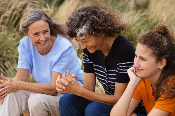 family laughing at beach