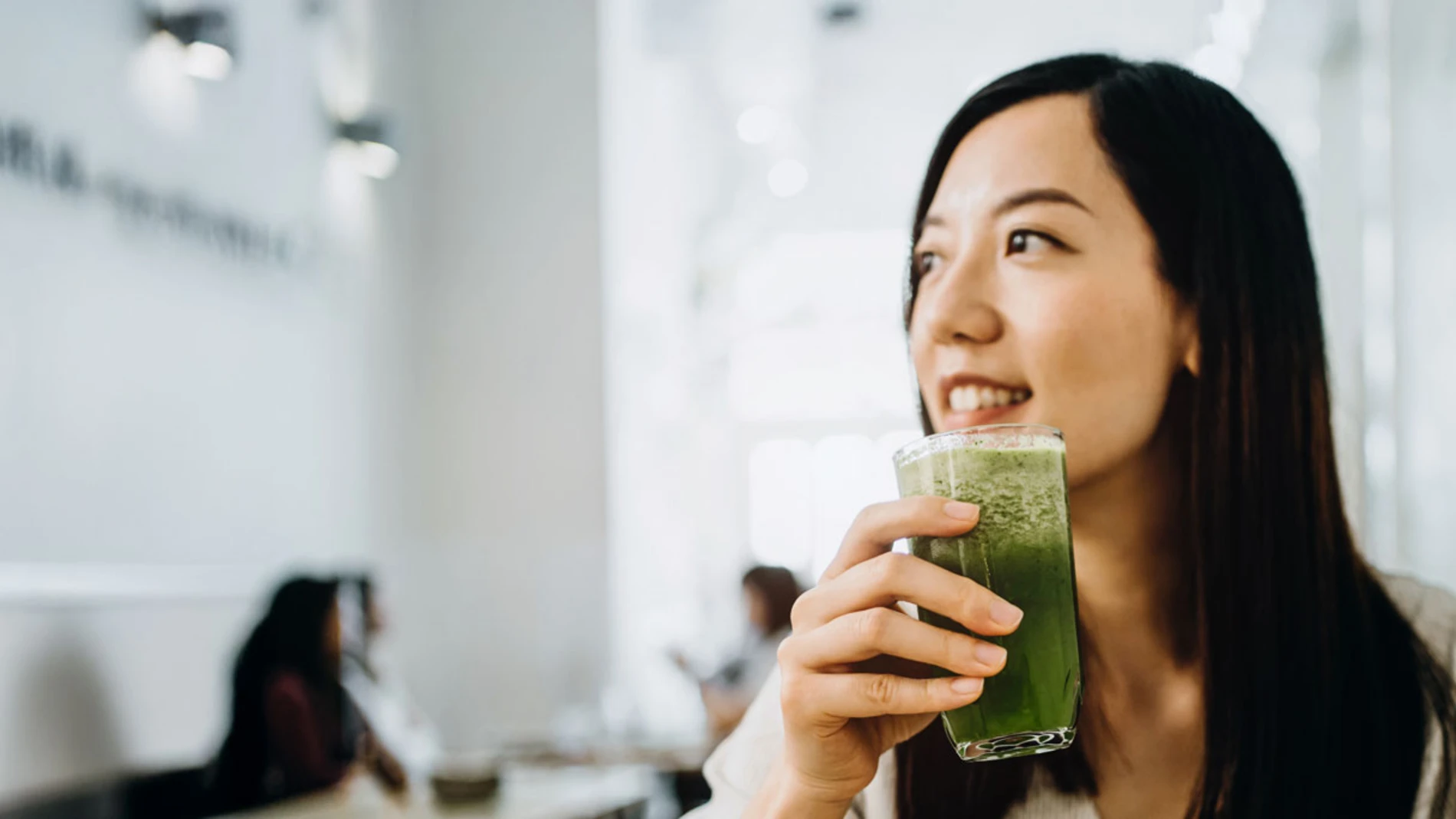 Woman drinking a healthy vegetable juice