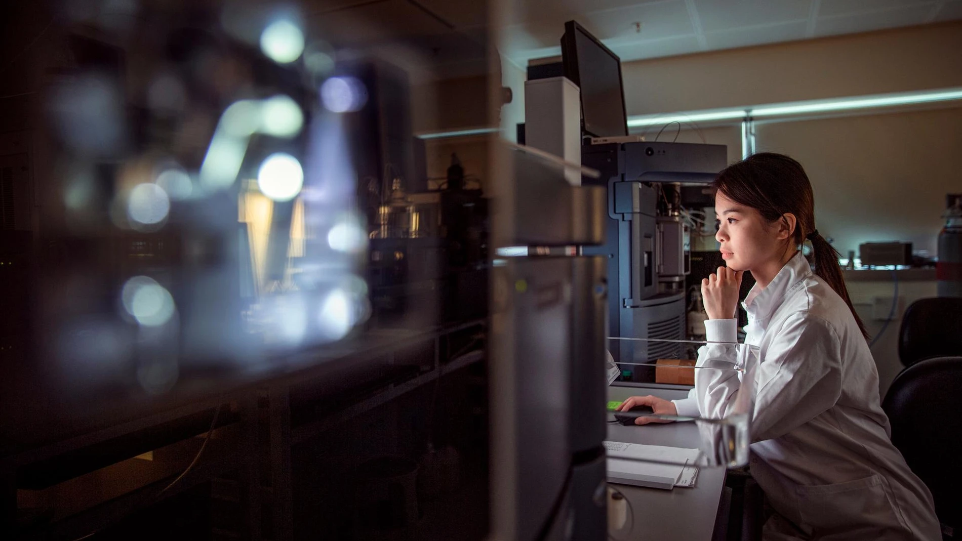 scientist looking at computer