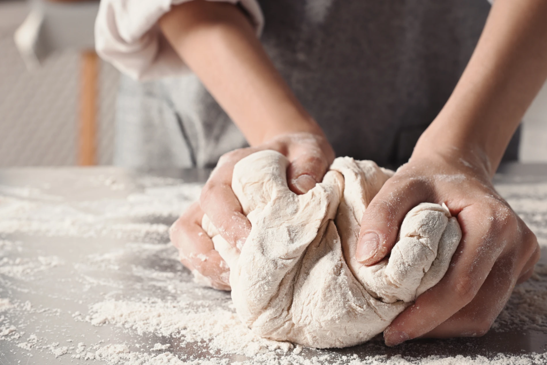 Closeup hands preparing dough 