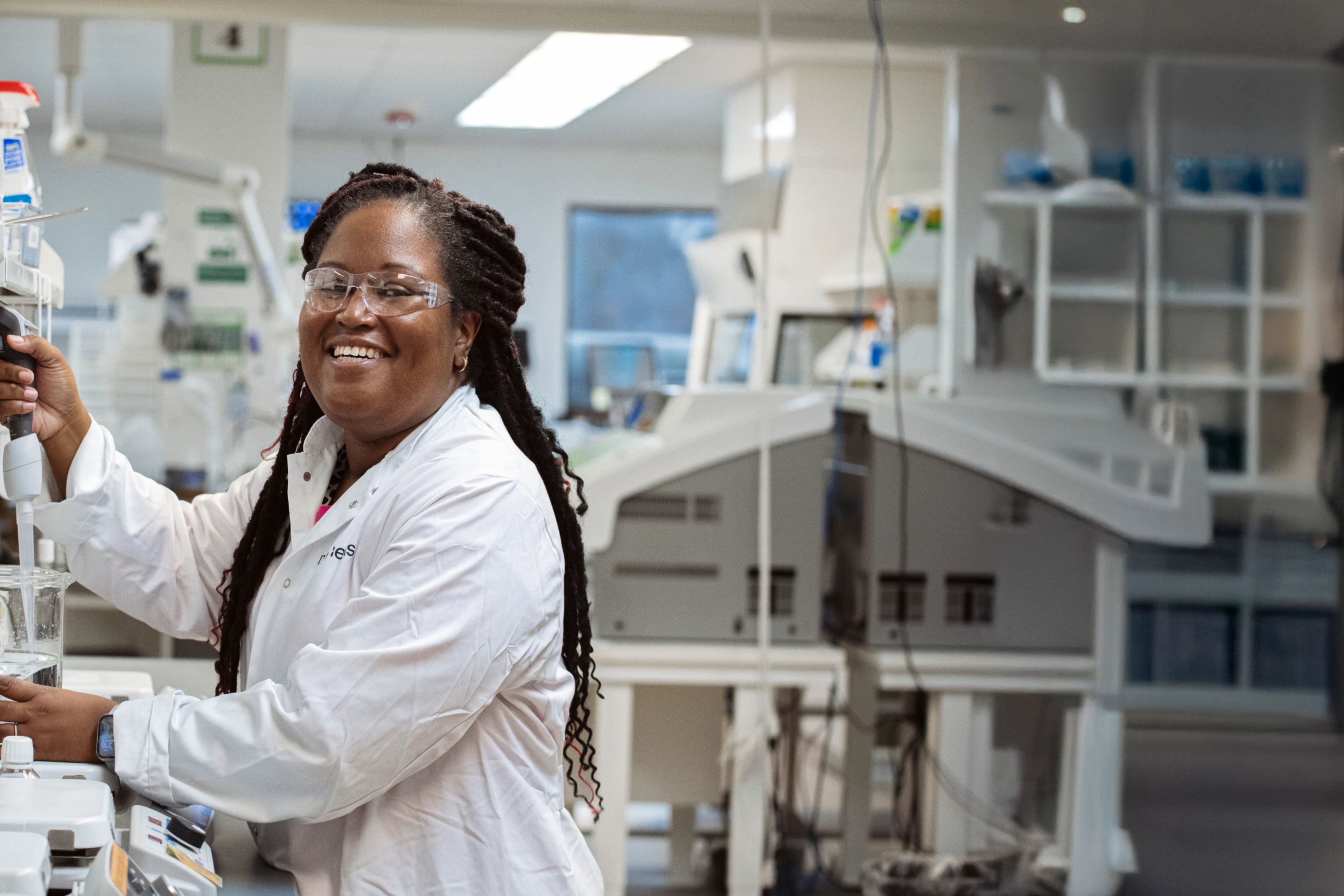 Girl smiling to camera in lab