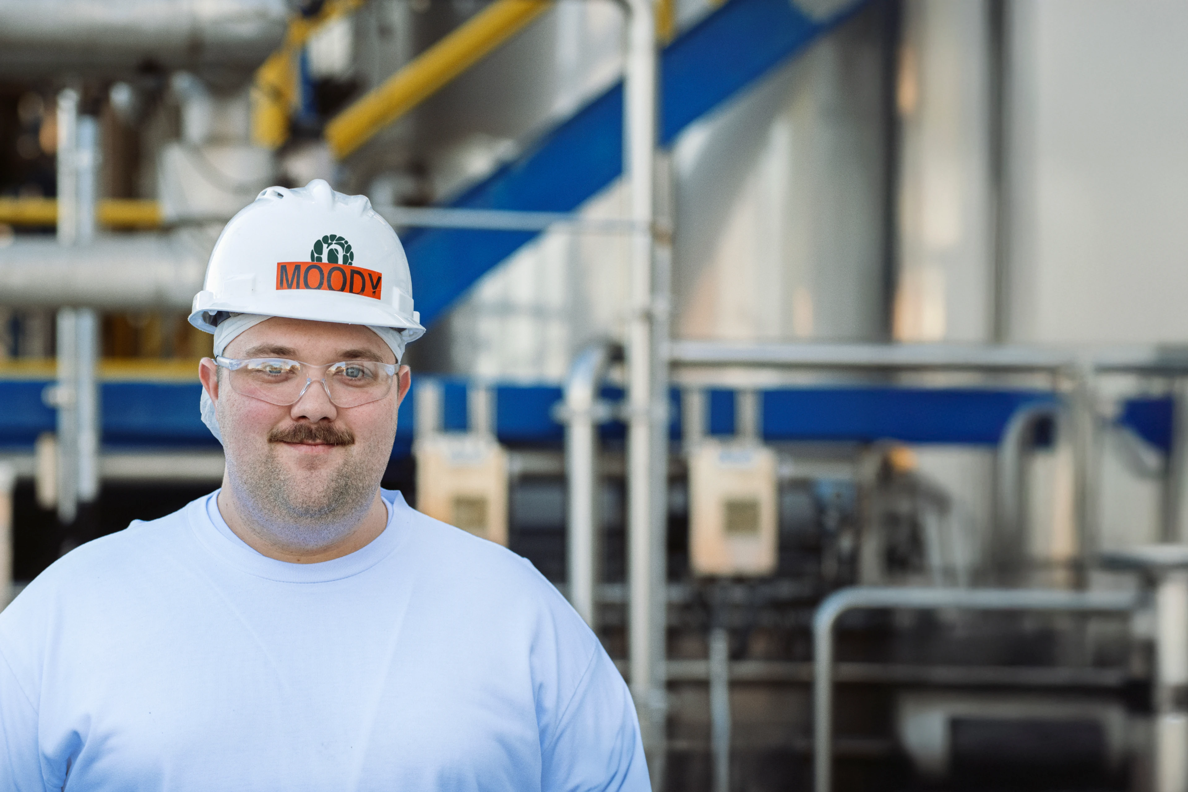 Guy in industry smiling to camera