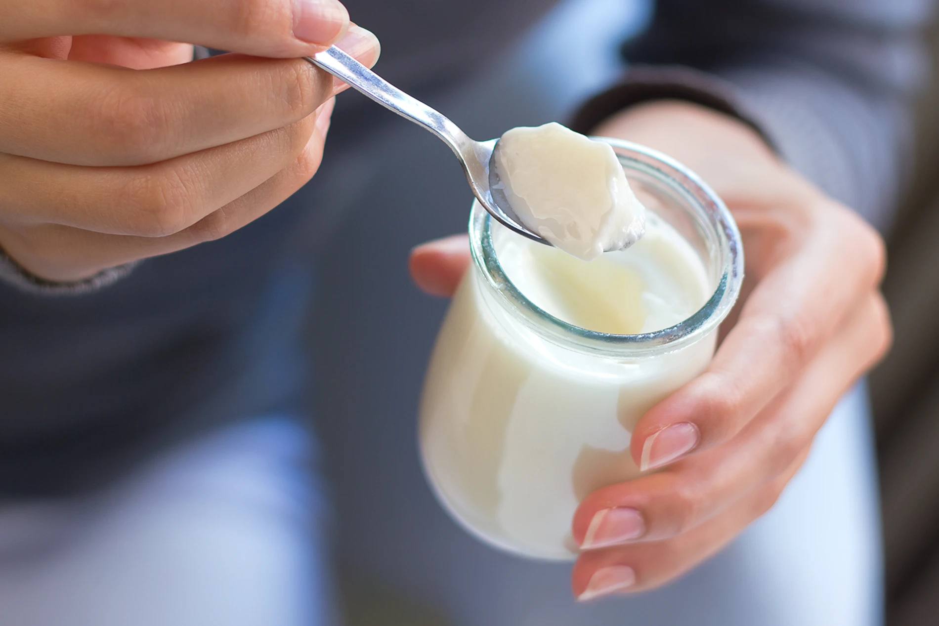 woman eating yogurt