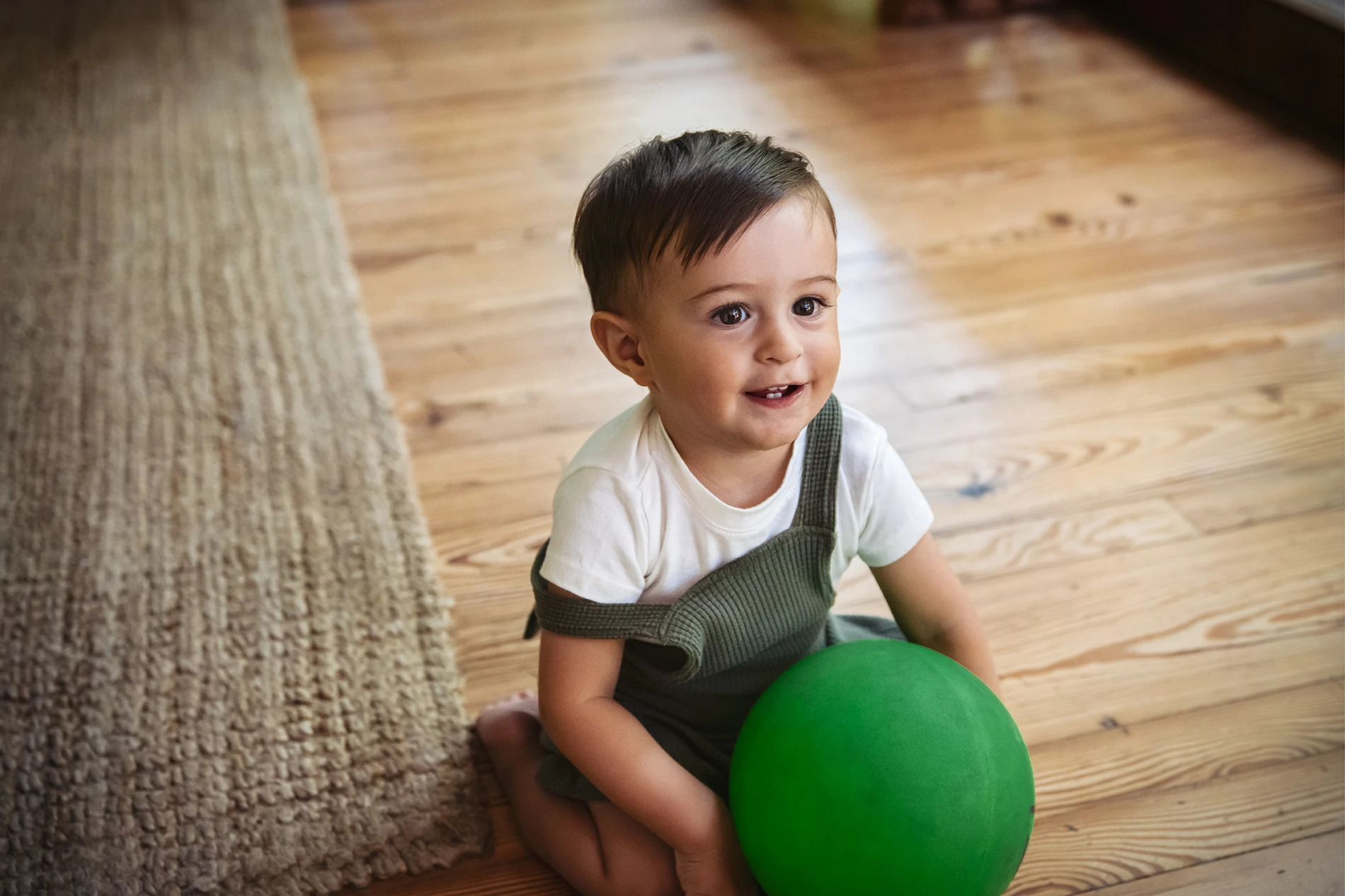 toddler-boy-ball-floor-001-