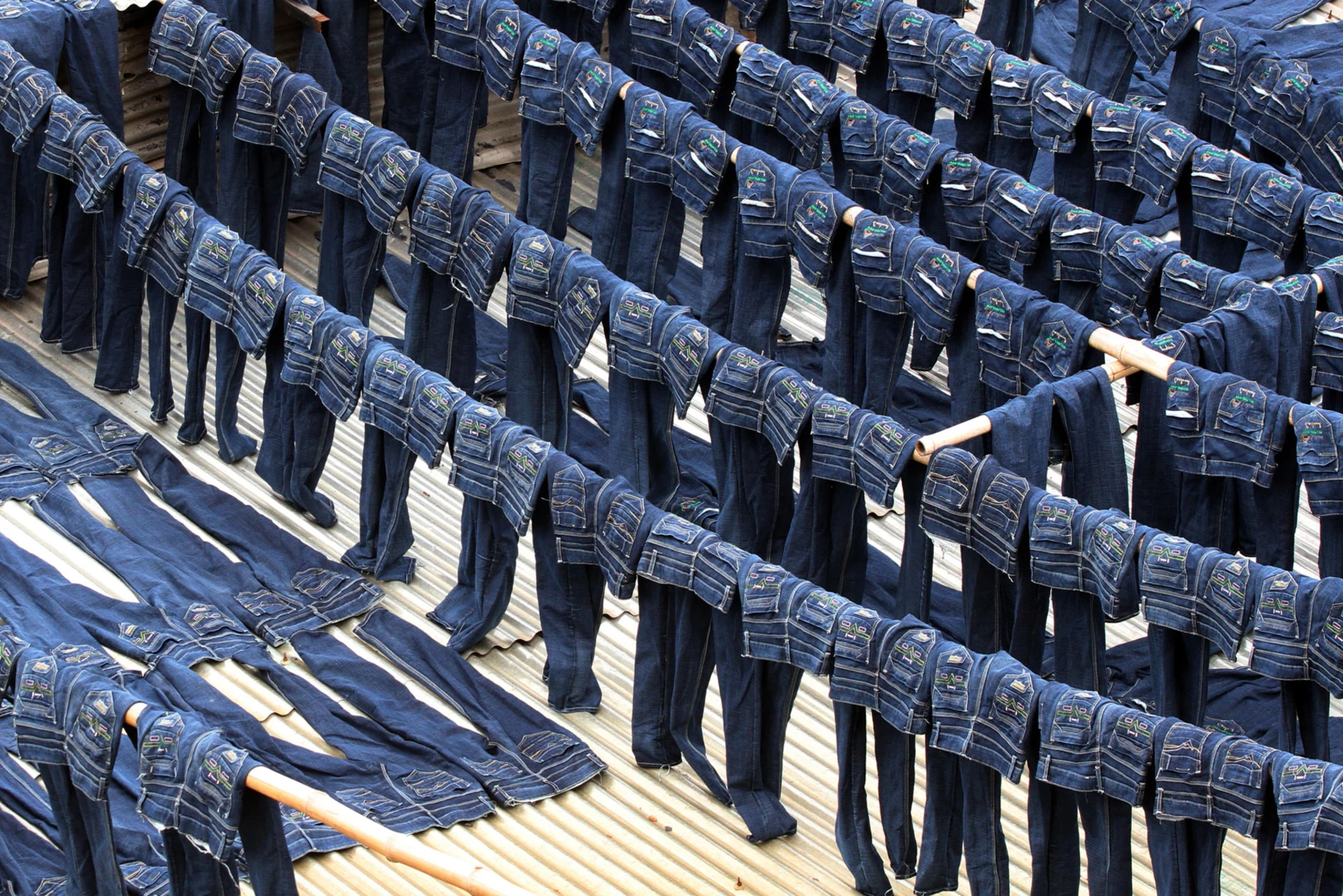 a bunch of jeans hanging outdoor